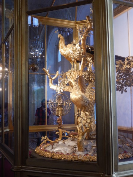 It looks like solid gold, but every part of this peacock clock moves when it chimes.