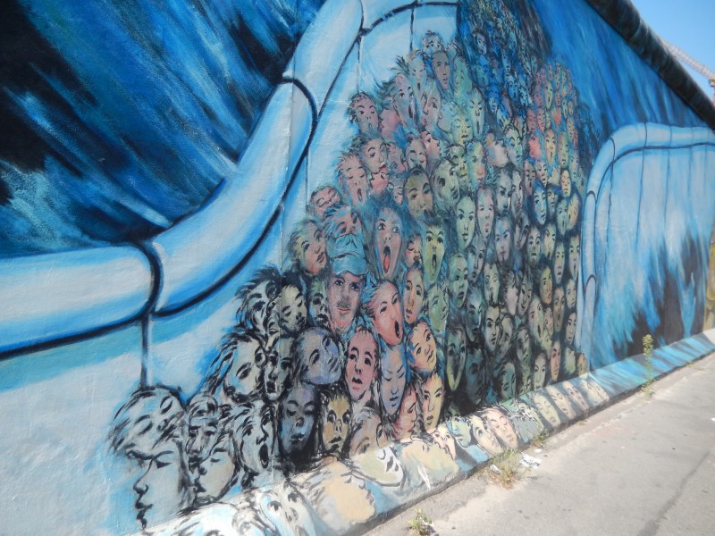 Some of the Wall was left standing and citizens were invited to paint murals on it. This portion portrays the stream of people coming through the crumbled Wall.