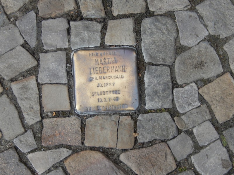 Berlin doesn't want to forget. This is a "single stone," set very slightly higher than the surrounding cobblestones. Each one is inscribed with a name and placed in front the house from which that person "disappeared."