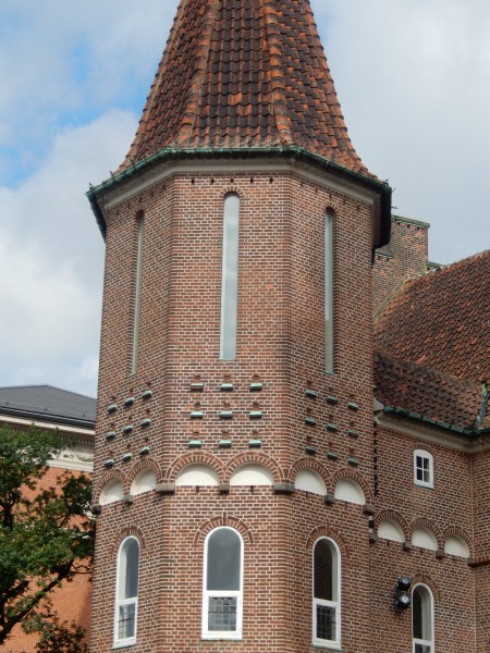 There are nine pigeon holes on each face of the tower, just below the long narrow windows.