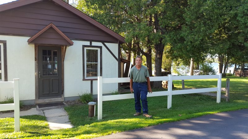 Jake in front of his cottage. He has park-like property across from the cottage and it's beautiful!