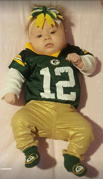 Barely a month old and already dressed in Packer green and gold from head to toes.