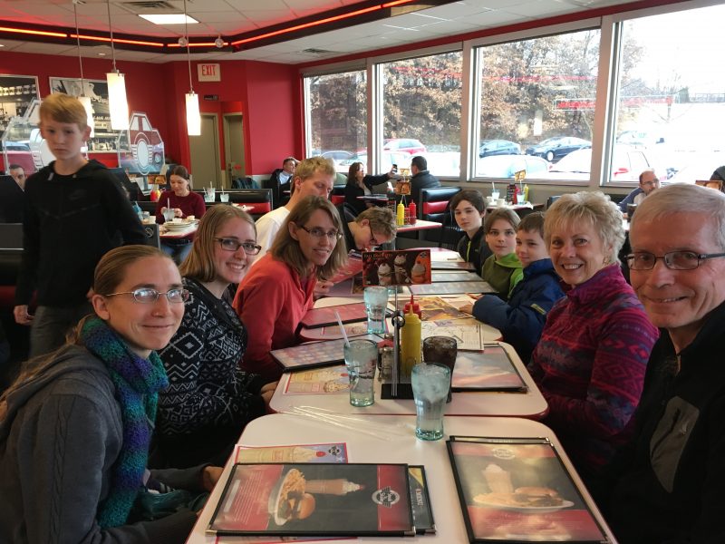 Here we are at Steak 'n' Shake, with our menus at the ready, pondering which flavor shake to order.
